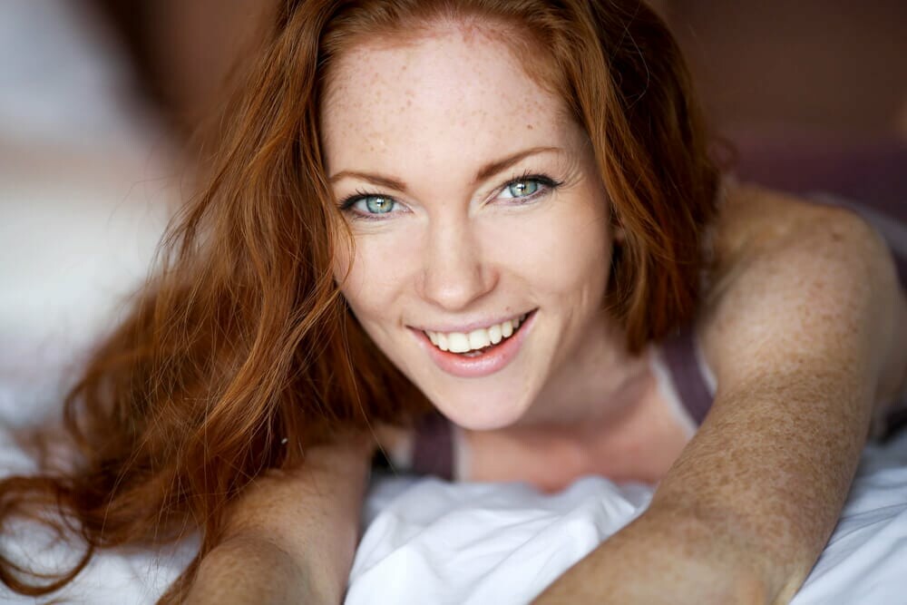 Smiling woman with freckles